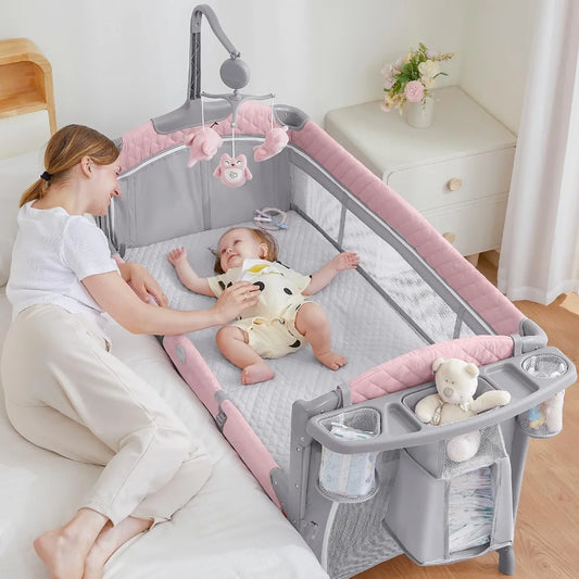 L Baby Bassinet Bedside Crib, Pack and Play with Mattress, Diaper Changer and Playards from Newborn to Toddles, Pink